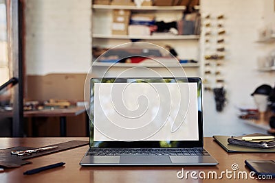 Laptop Mockup in Workshop Stock Photo