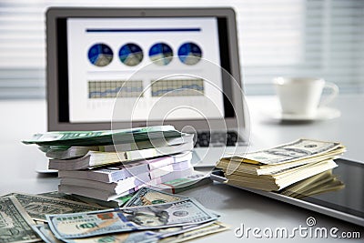 Laptop and money. Stock Photo