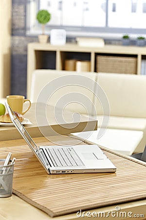 Laptop on morning table Stock Photo