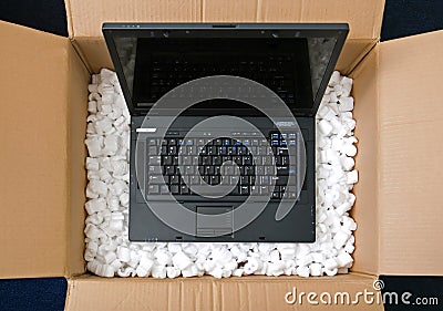 Laptop in opening package box Stock Photo