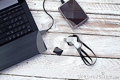 Laptop with pendrive, sd card and portable hard drive. Stock Photo