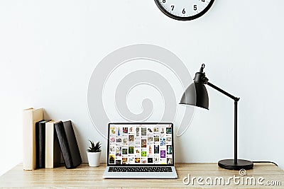 laptop with pinterest website on screen on work desk Editorial Stock Photo