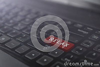 Laptop red keyboard button with word relax, rest time concept Stock Photo