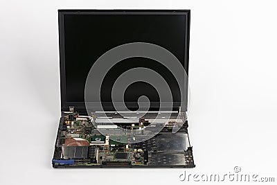 Laptop, removed keyboard, hard disk drive, CD drive, battery , CPU fan. Visible mainboard with CPU and graphics card Stock Photo
