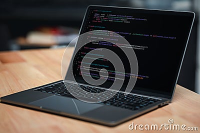 Laptop screen display blur script code, compiler, encode, debug, developer application software for business corporate with laptop Stock Photo