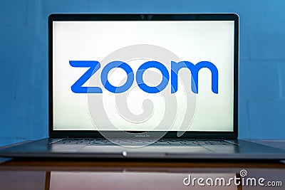 Laptop showing Zoom Cloud Meetings app logo. Editorial Stock Photo