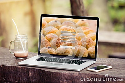 Laptop with Sign up username password concept on screen in the park / garden Stock Photo