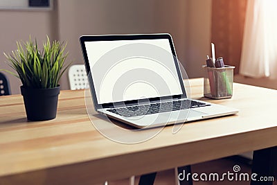 Laptop on table in the office room background, for graphics display montage. Stock Photo