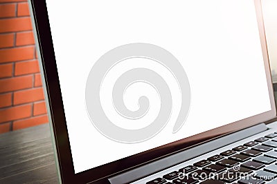 Laptop on table in office room, There is a brick red background, for graphics display montage. Take your screen to put on advertis Stock Photo