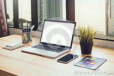 Laptop on table in office room on window city background, for graphics display montage. Stock Photo