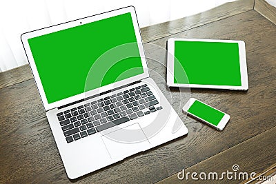 Laptop with tablet and smart phone on table Editorial Stock Photo