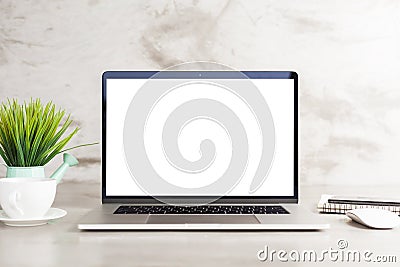 Laptop white blank screen on work table front view Stock Photo