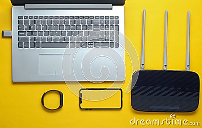 Laptop, wi-fi router, smartphone, smart tracker Stock Photo