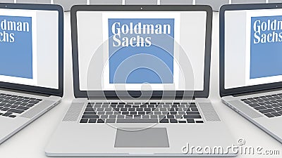Laptops with The Goldman Sachs Group, Inc. logo on the screen. Computer technology conceptual editorial 3D rendering Editorial Stock Photo