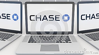 Laptops with JPMorgan Chase Bank logo on the screen. Computer technology conceptual editorial 3D rendering Editorial Stock Photo