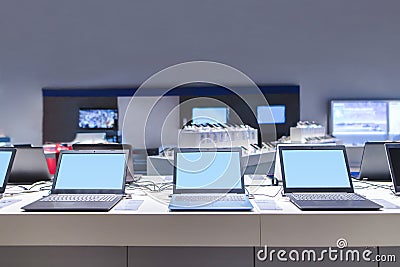 Laptops in the modern electronics store. Computer department in the technology store Editorial Stock Photo