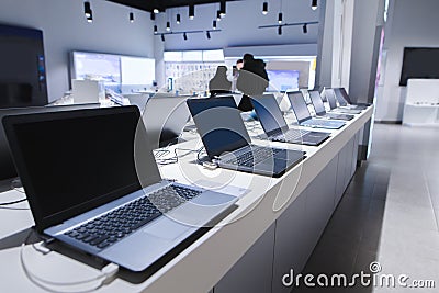 Laptops in a modern technology store. Department of computers in the electronics store. laptop in the store Editorial Stock Photo