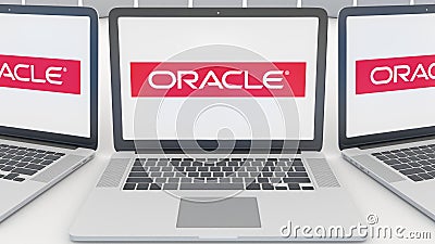 Laptops with Oracle Corporation logo on the screen. Computer technology conceptual editorial 3D rendering Editorial Stock Photo