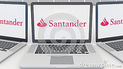 Laptops with Santander Serfin logo on the screen. Computer technology conceptual editorial 3D rendering Editorial Stock Photo