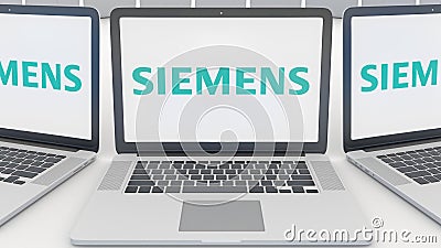 Laptops with Siemens logo on the screen. Computer technology conceptual editorial 3D rendering Editorial Stock Photo
