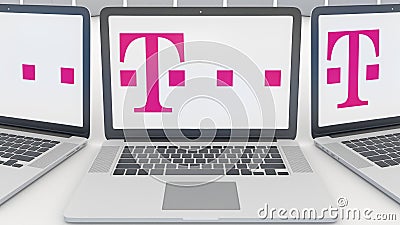 Laptops with T-Mobile logo on the screen. Computer technology conceptual editorial 3D rendering Editorial Stock Photo