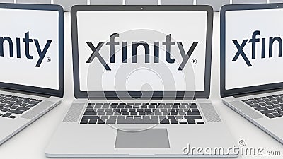 Laptops with Xfinity logo on the screen. Computer technology conceptual editorial 3D rendering Editorial Stock Photo