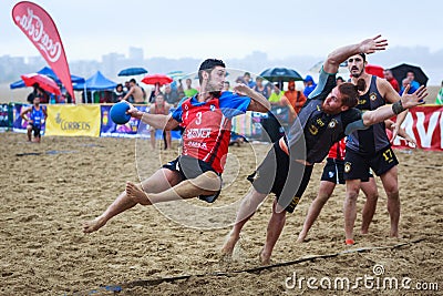 LAREDO, SPAIN - JULY 30: Unidentified player launches to goal in the Spain handball Championship celebrated in the beach of Laredo Editorial Stock Photo