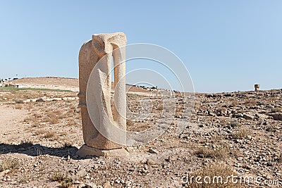 Large abstract figure carved from stone in a public sculpture park in the desert, on a cliff above the Judean Desert near Mitzpe Stock Photo