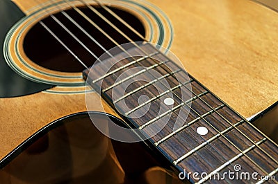 Large acoustic guitar with sound hole and pickguard Stock Photo