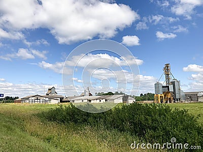 Large agricultural agricultural farm building with equipment, houses, barns, granary Stock Photo