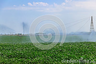 Large agricultural irrigation system in field Stock Photo