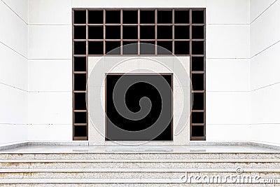 Aluminum door frames and white stone walls at the entrance to the building Stock Photo