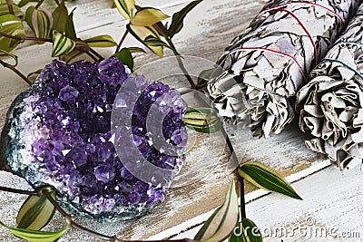 Large Amethyst Cluster and White Sage Bundle Stock Photo