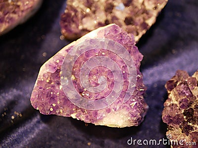 Large amethyst on purple background Stock Photo