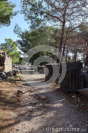 Large ancient marble column fragment in the ruins of greek city Priene , Turkey Stock Photo