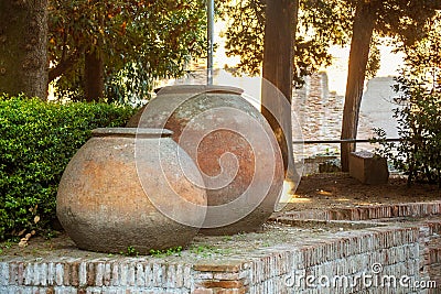 Large antique pots near of the ruins of the Flavian Amphitheater in Pozzuoli. Stock Photo