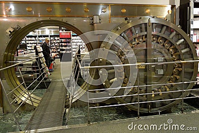 Large Bank Vault Door Opened in Bookstore Stock Photo