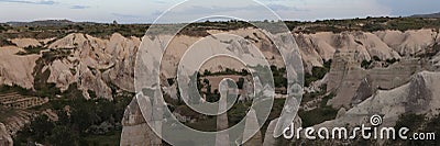 Large bare steep sandy cliffs in Cappadocia highland Stock Photo