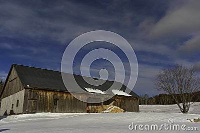 Large barn in the Canadian countryside by a nice day Stock Photo
