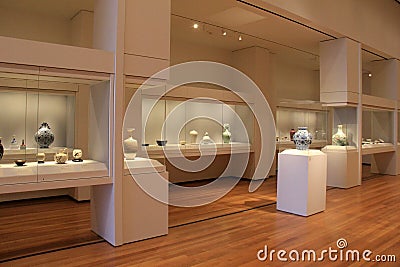 Large,beautiful room with glass cases filled with pottery,Cleveland Art Museum,Ohio,2016 Editorial Stock Photo