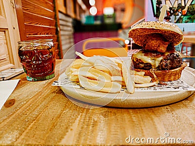 Large beef and cheese burger with skull Stock Photo