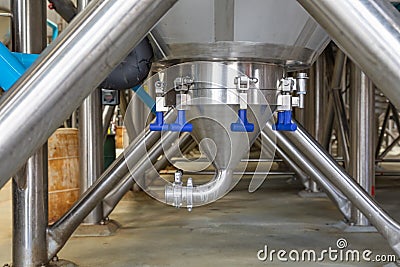 Large Beer Brewery Fermentation Tanks in Warehouse Stock Photo