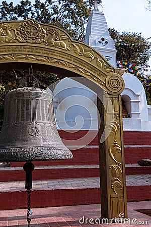 A large bell and small stupa at Bajradhatu Chaitya, at the entrance of Swayambhunath Stupa Stock Photo