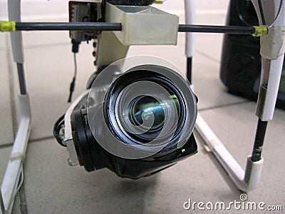 A large black camcorder is attached to the drone Stock Photo