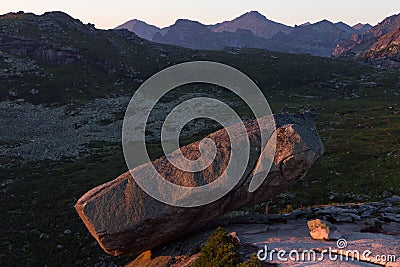 A large boulder on the edge of the abyss. Stock Photo