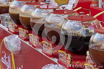 Large bowls of delicious sweet Yemen honey for sale at Global Market in Dubai, UAE Editorial Stock Photo
