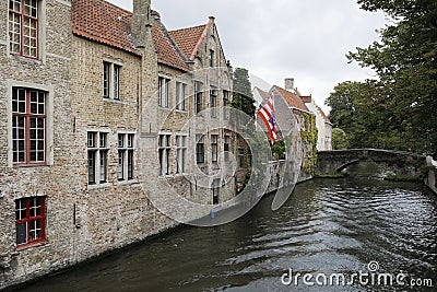 Large, brick buildings right on the canal Editorial Stock Photo