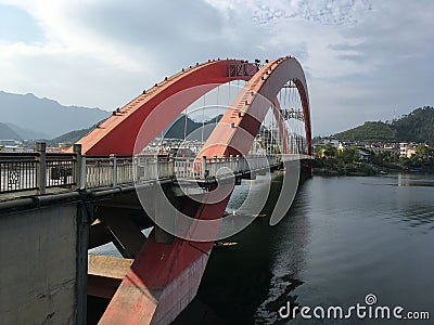 A large bridge spans across the river Stock Photo