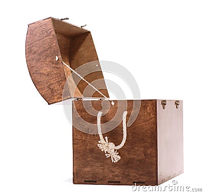 Large brown box with a beige handle rope, isolated on a white background. Old chest for keeping various colorful toys. Stock Photo