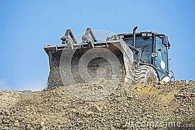 Large bucket of an escalator frontally on a sunny hot day against the sky. Global construction. Mining, salt Stock Photo